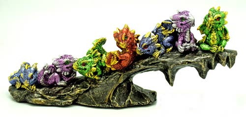 7 Baby Dragons on Rock